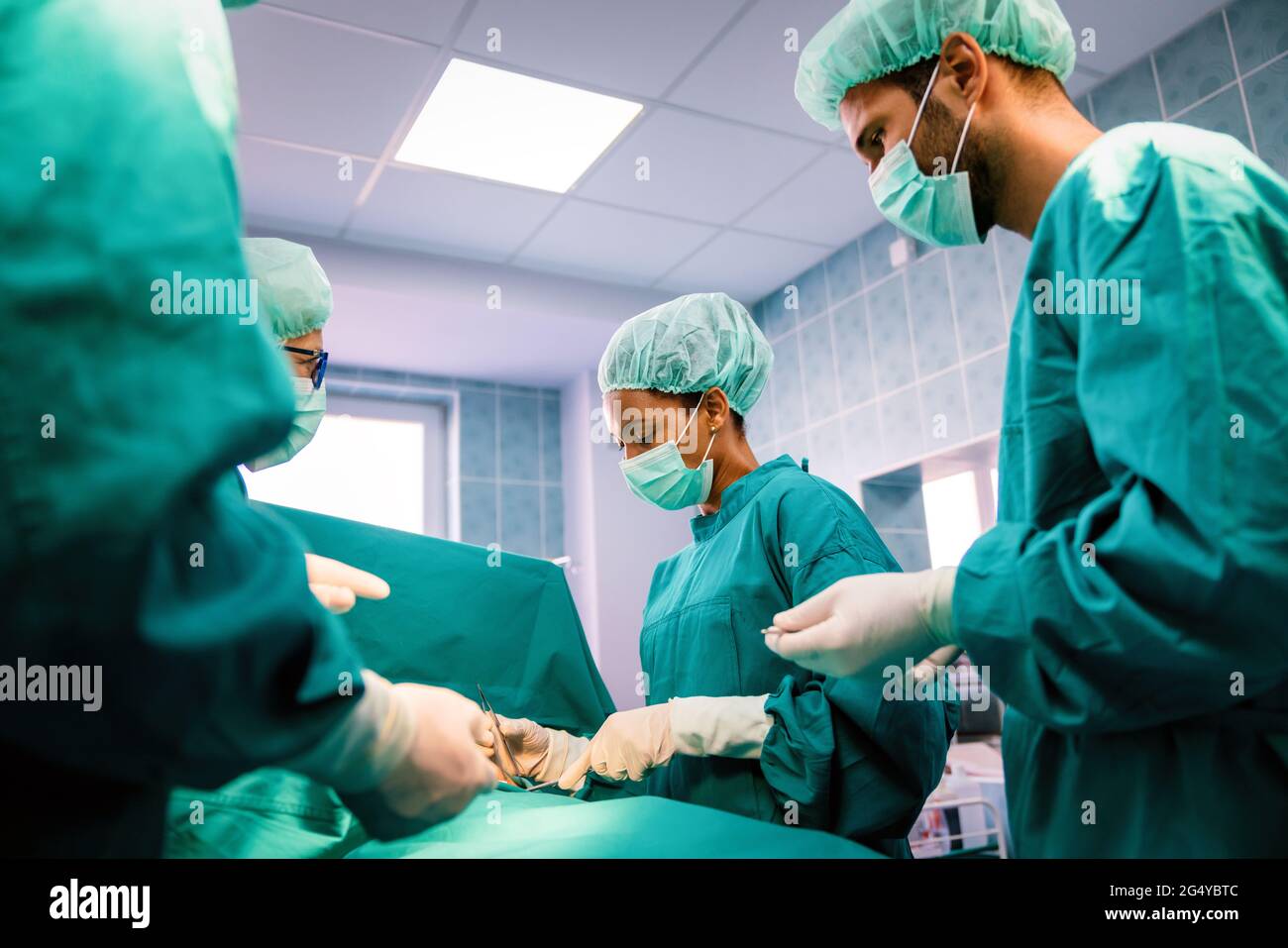Group of surgeon team at work in operating room in hospital Stock Photo ...