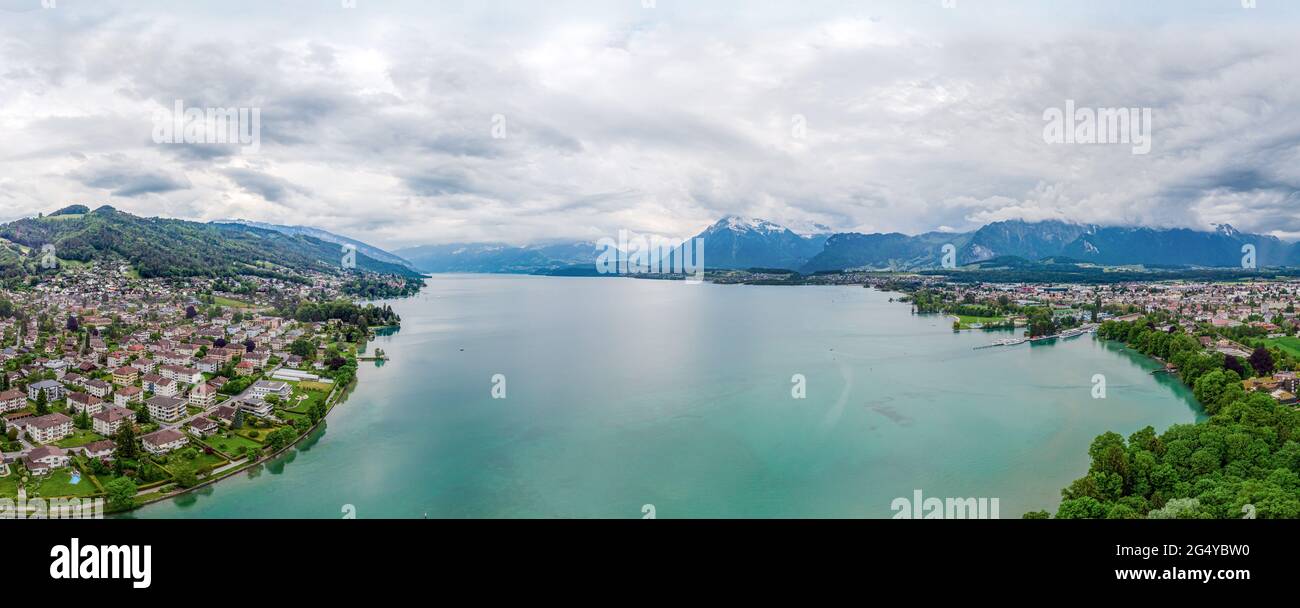 Amazing postcard 180 degree panorama view on Thun Lake (Thunersee, Thuner See), alps mountains. Switzerland. Stock Photo