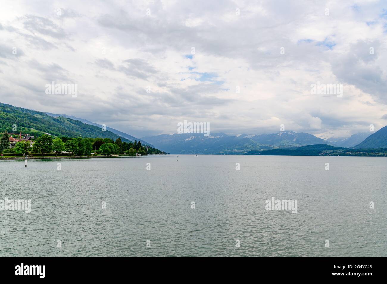 Amazing postcard view on Thun Lake (Thunersee, Thuner See), alps mountains Eiger, Jungfrau, Monch (Moench, Mönch), with a birds. Thun, Switzerland. Stock Photo