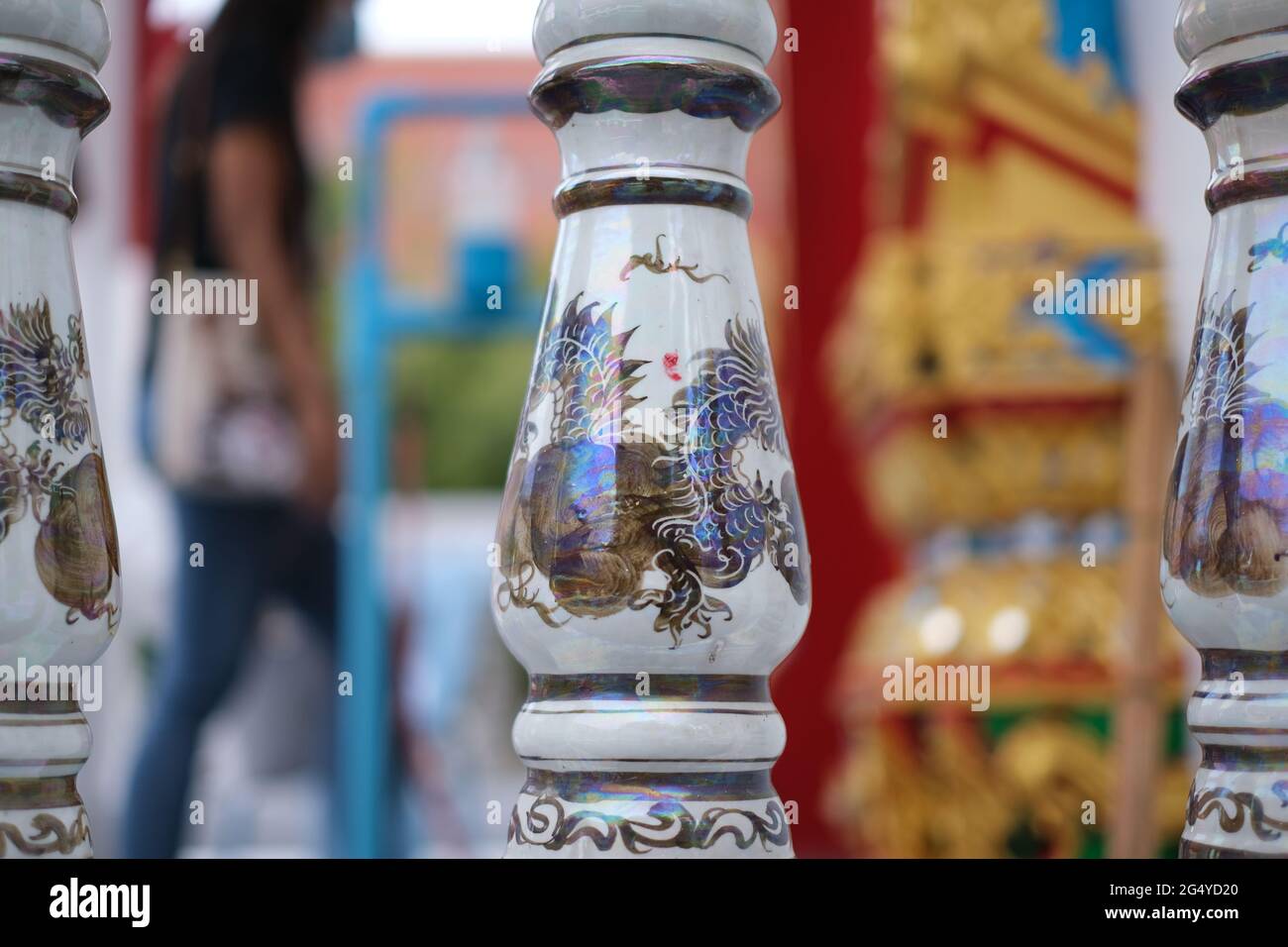 Railing at the entrance to Buddhists temple, painted with Chinese-style dragons Stock Photo