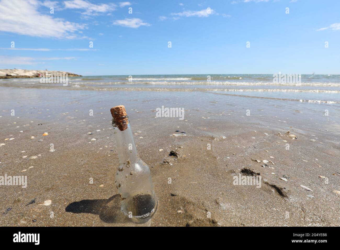 Stranded Glass glass bottle stranded on the shore near the beach that can contain a ...
