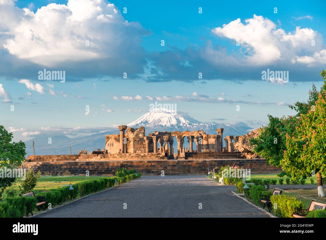 The ruins of the ancient Zvartnots temple on the background of a high snow-capped mountain Ararat, a landmark of Armenia Stock Photo