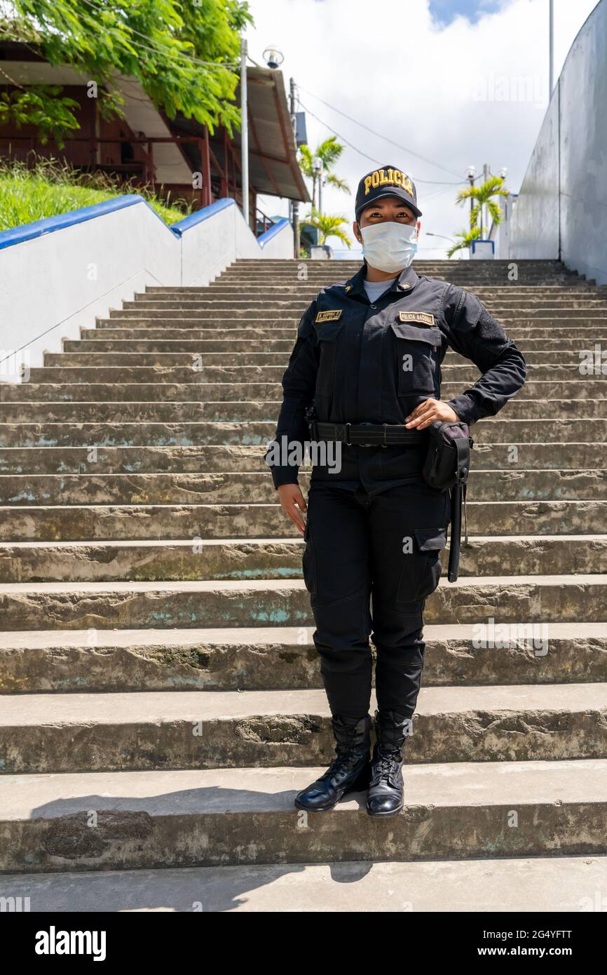 National Policewoman provides protection in the port city of Iquitos, Peru Stock Photo