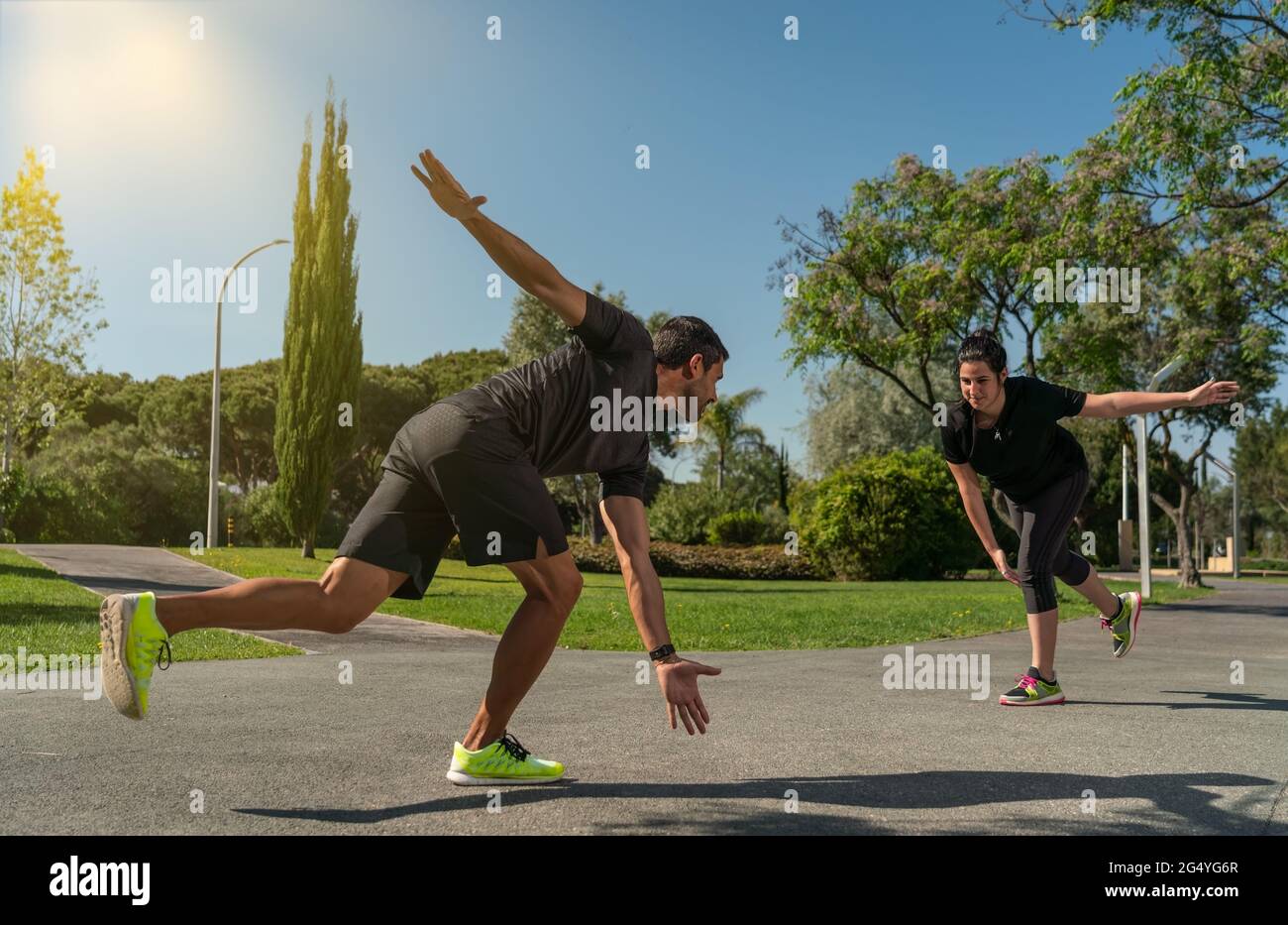 Personal fitness trainer for functional training, coaches a client for