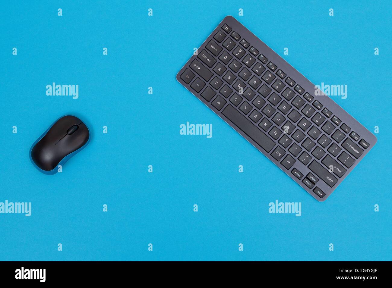 Office Workplace with Digital Gadgets Lying on Blue Table - Flat Lay Stock Photo