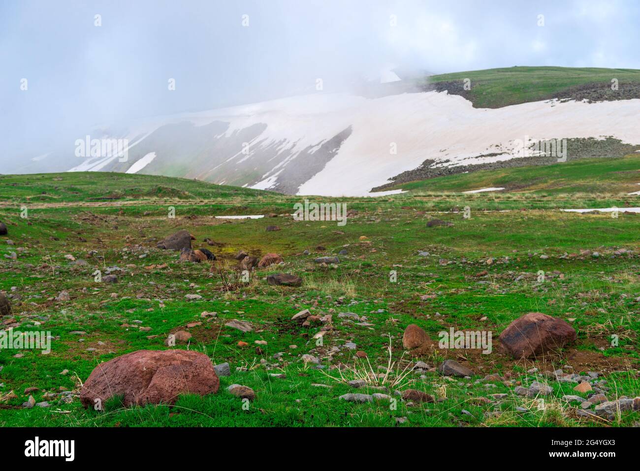 Highlands of Armenia with the remnants of snow in June Stock Photo