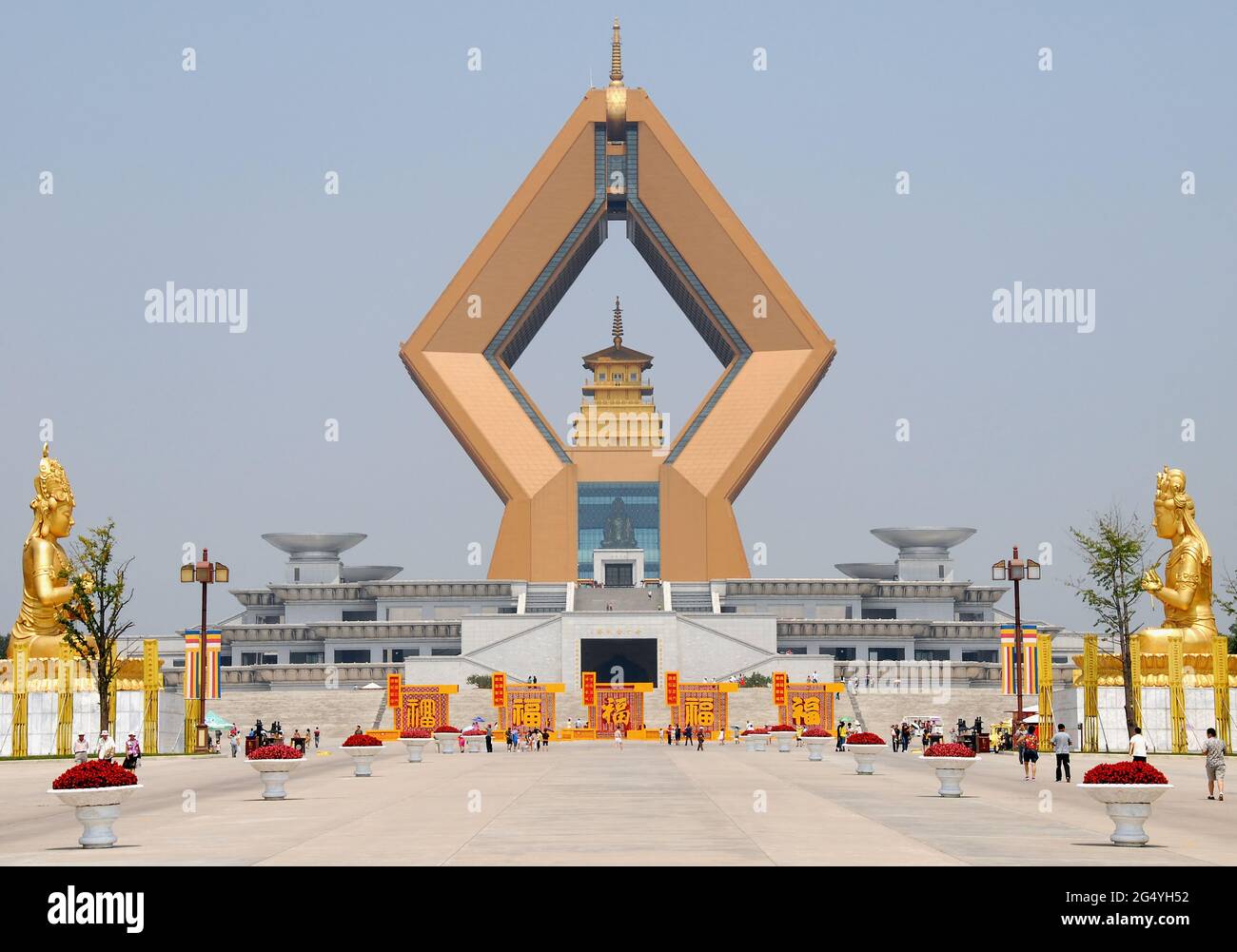 Famen Temple, Shaanxi Province, China: The huge diamond-shaped Namaste Dagoba, part of the new complex at the Famen Temple. With gold statues. Stock Photo