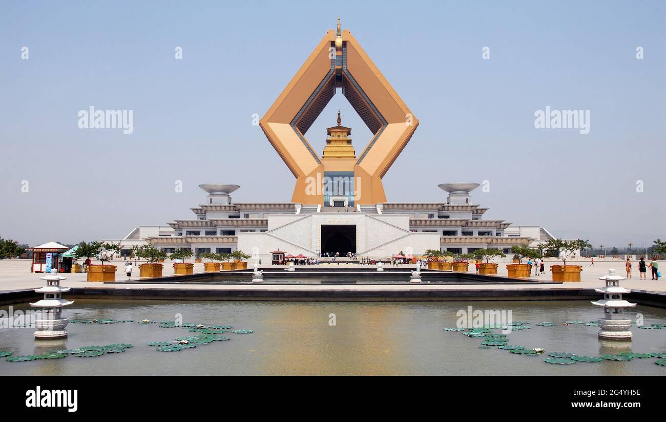 Famen Temple, Shaanxi Province, China: The huge diamond-shaped Namaste Dagoba, part of the new complex at the Famen Temple. With ceremonial pools. Stock Photo