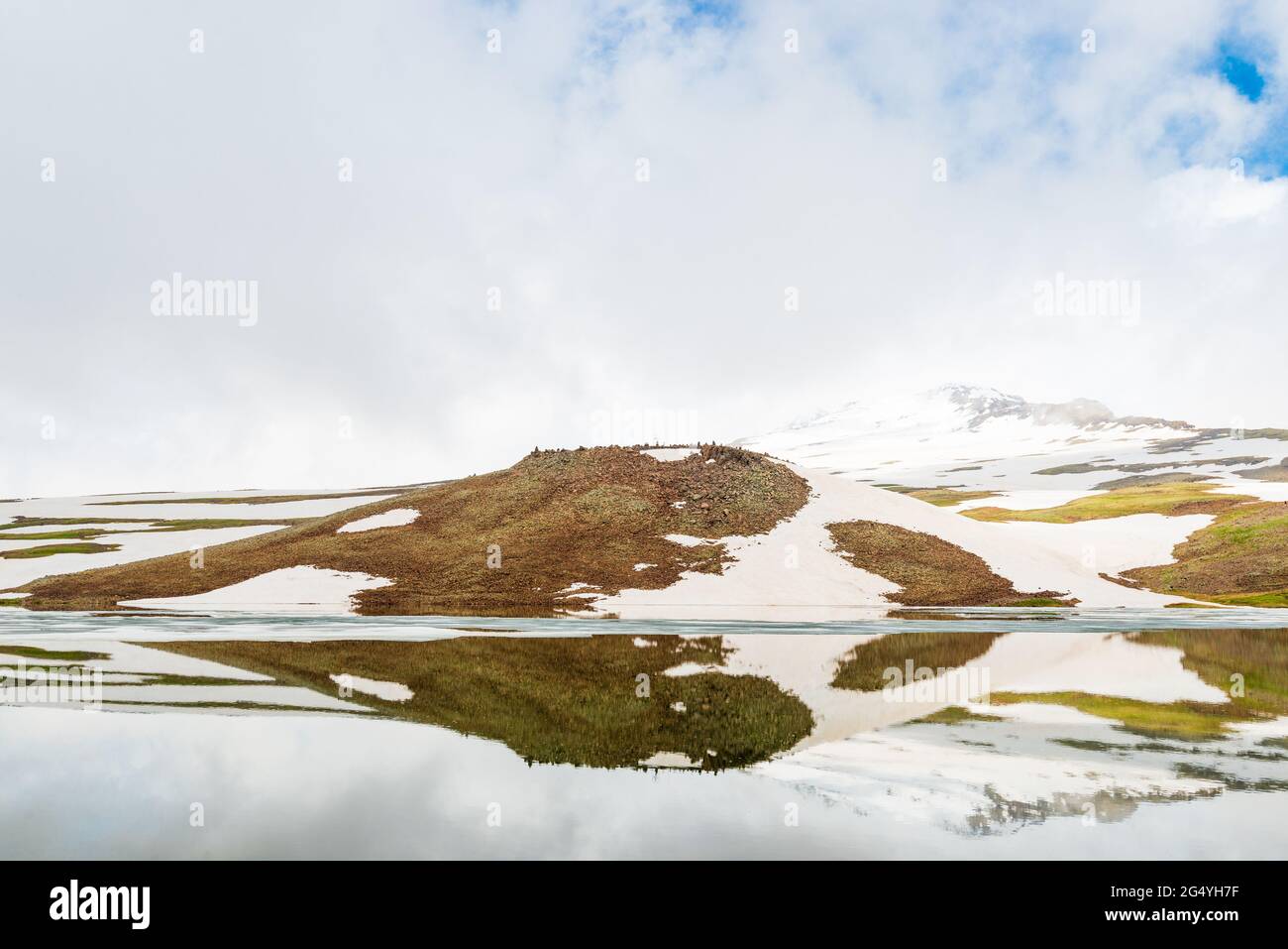 scenic view of the frozen lake Kari high in the mountains of Armenia in summer Stock Photo