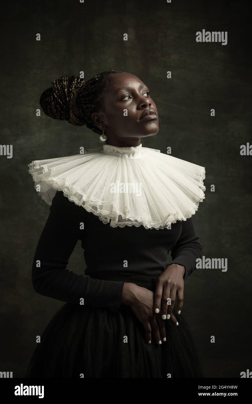 Close-up portrait of medieval African young woman in black vintage ...