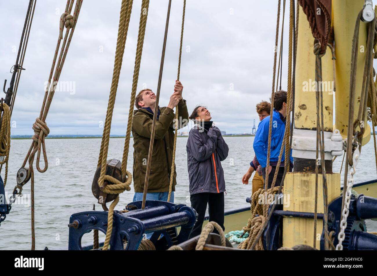 Learning the ropes A passenger on "Edith May" sailing barge helps with
