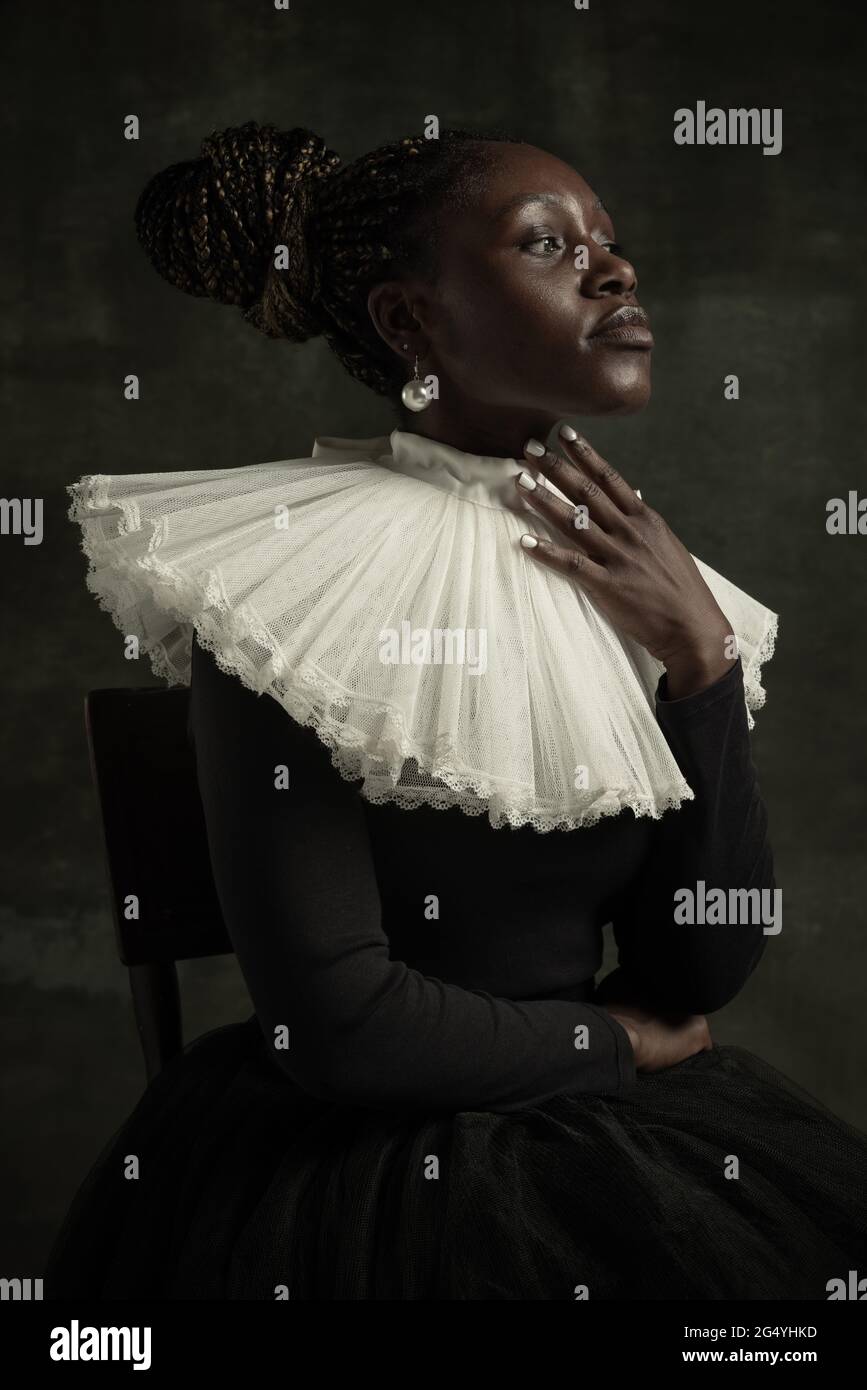 Close-up portrait of medieval African young woman in black vintage ...