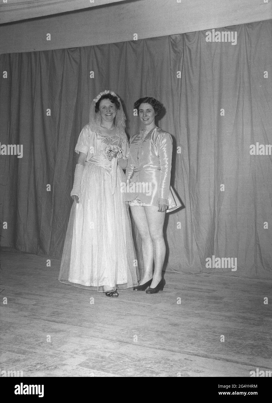 1954, historical, two female performers standing on stage in their costumes for the pantomine, Mother Goose, England, UK. Stock Photo