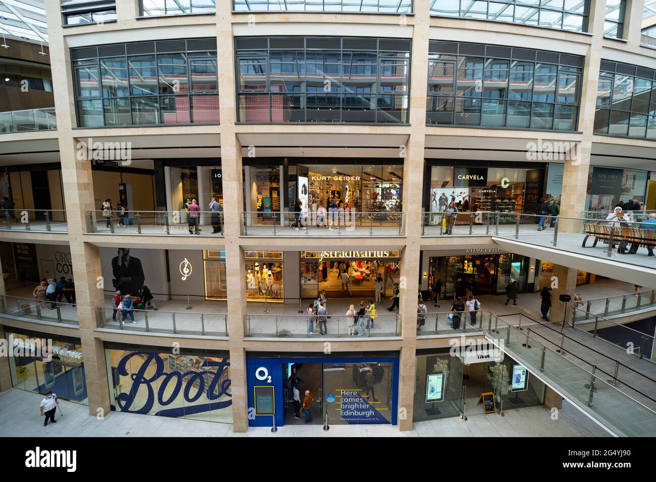 Edinburgh, Scotland, UK. 24 June 2021. First images of the new St James Quarter which opened this morning in Edinburgh. The large retail and residential complex replaced the St James Centre which occupied the site for many years. Pic; Shops are spread over several levels inside full height atrium.  Iain Masterton/Alamy Live News Stock Photo