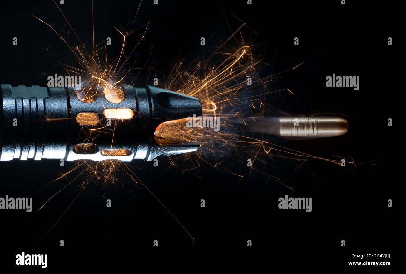 Copper bullet after leaving the barrel of an assault rifle with sparks