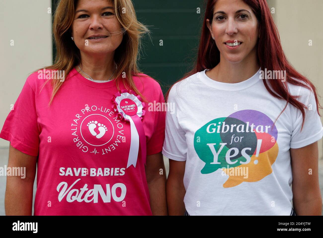 Women, among the organisers of the Yes and No campaign, pose for a photograph during the abortion referendum outside a polling station, in the British overseas territory of Gibraltar, June 24, 2021. REUTERS/Jon Nazca Stock Photo