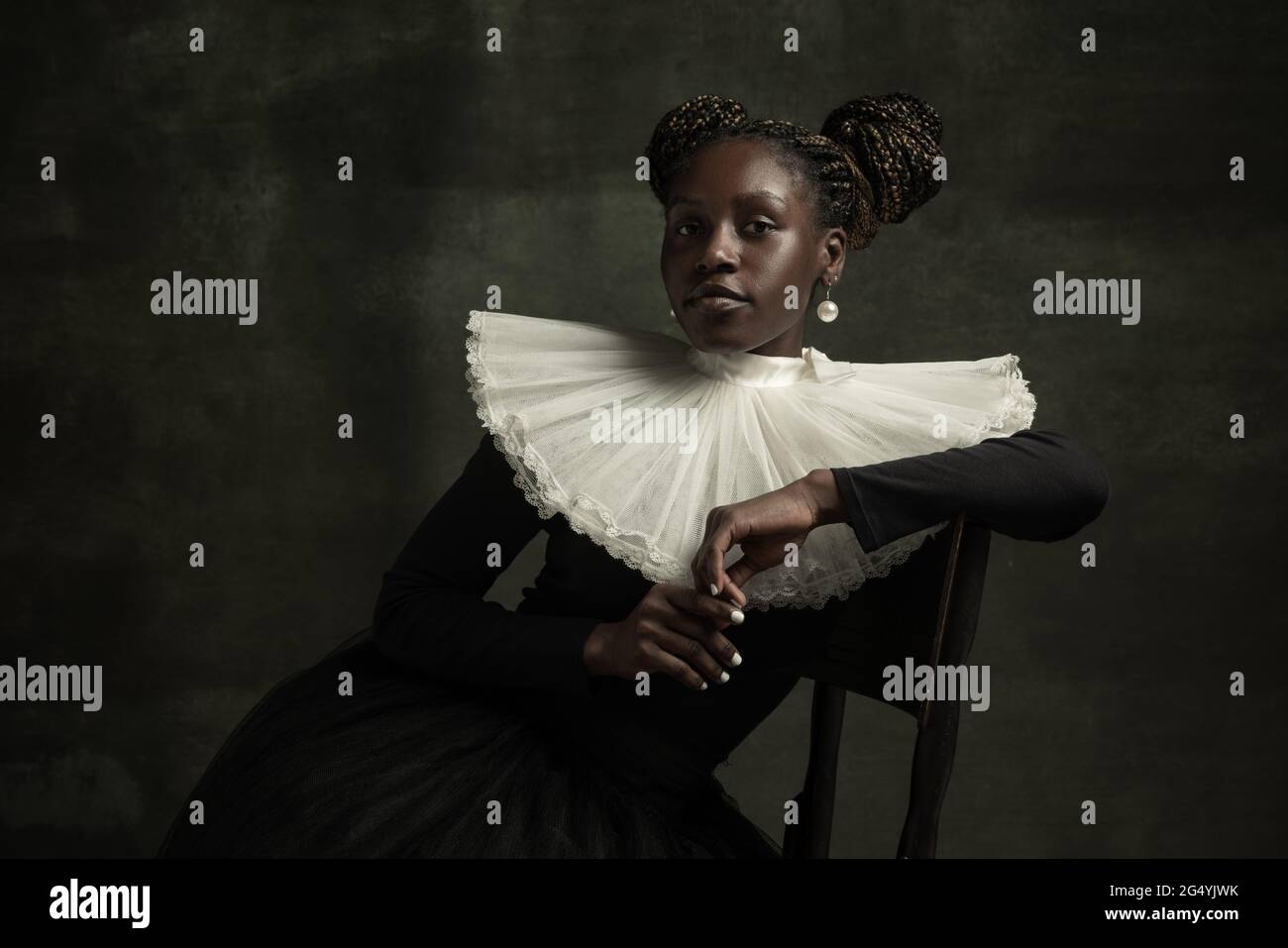 Portrait of medieval African young woman in black vintage dress with ...