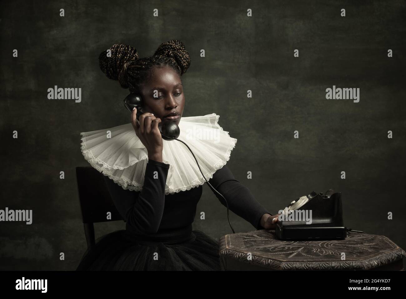 Portrait of medieval African young woman in black vintage dress with ...
