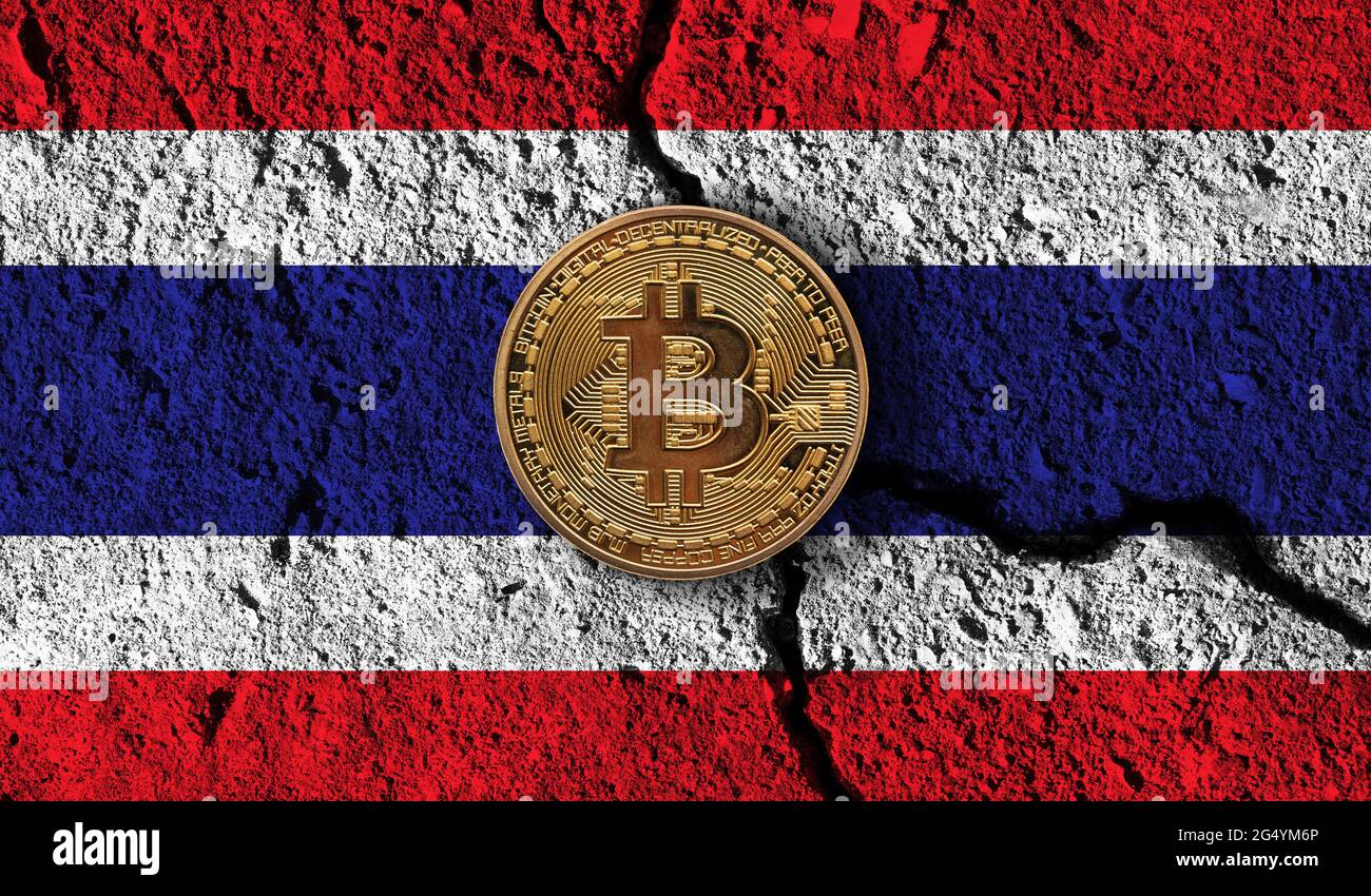 Bitcoin crypto currency coin with cracked Thailand flag. Crypto  restrictions Stock Photo - Alamy