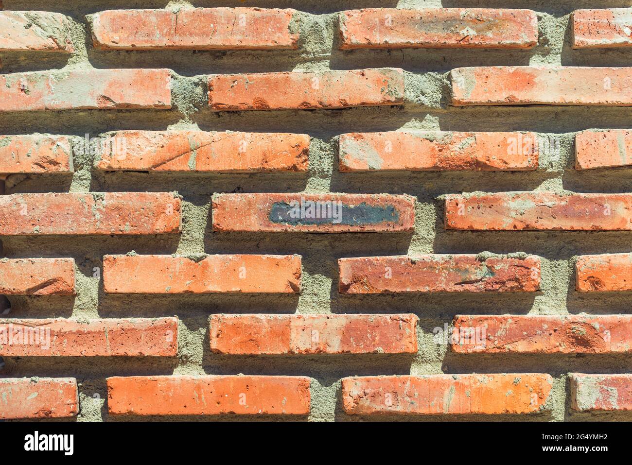 red brick masonry wall background closeup Stock Photo