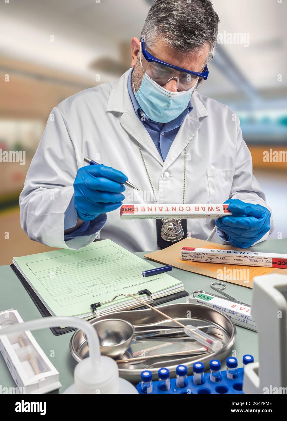 police scientist takes data from evidence box in crime lab, conceptual image Stock Photo