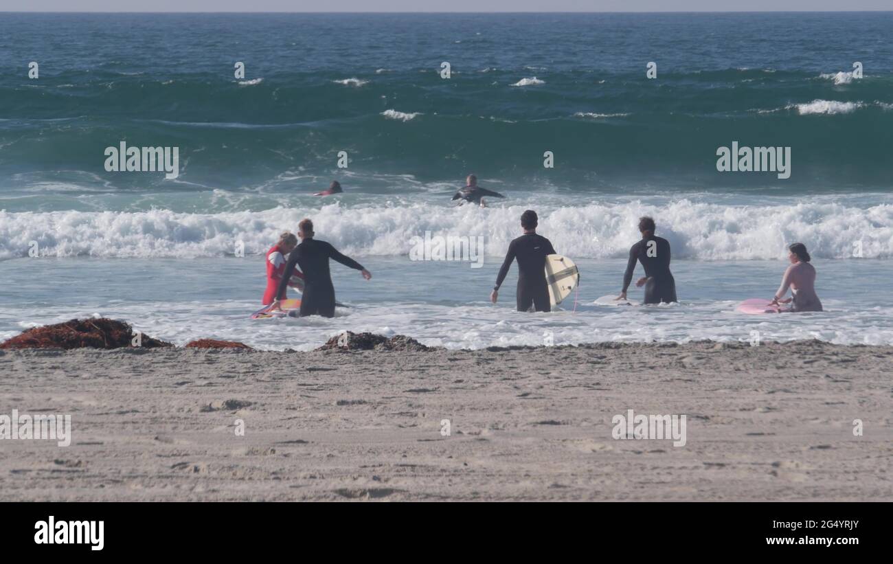 San Diego, California USA 19 Nov 2020 Surfers in ocean waves with