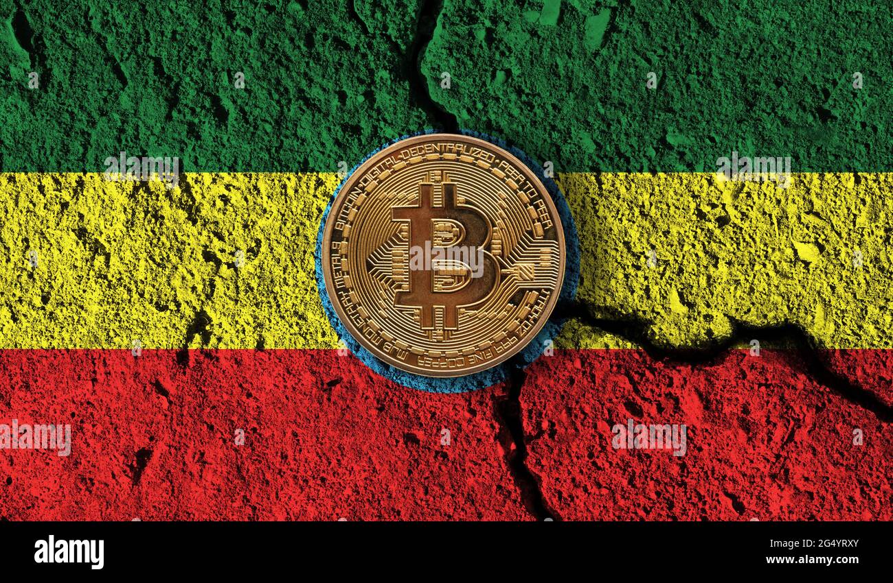 Bitcoin crypto currency coin with cracked Ethiopia flag. Crypto restrictions Stock Photo