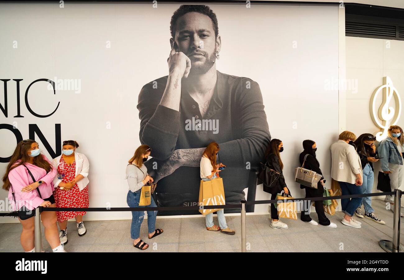 Edinburgh, Scotland, UK. 24 June 2021. First images of the new St James Quarter which opened this morning in Edinburgh. The large retail and residential complex replaced the St James Centre which occupied the site for many years. Pic; Queue of shoppers wait outside Stradivarius shop. Iain Masterton/Alamy Live News Stock Photo