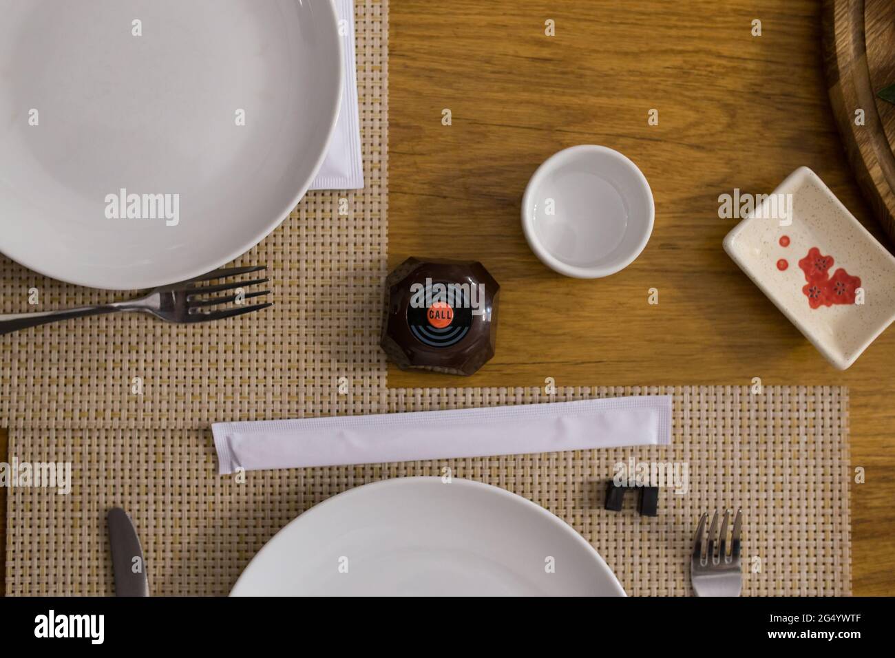 Call button on serve table in restaurant, view from a top. Stock Photo