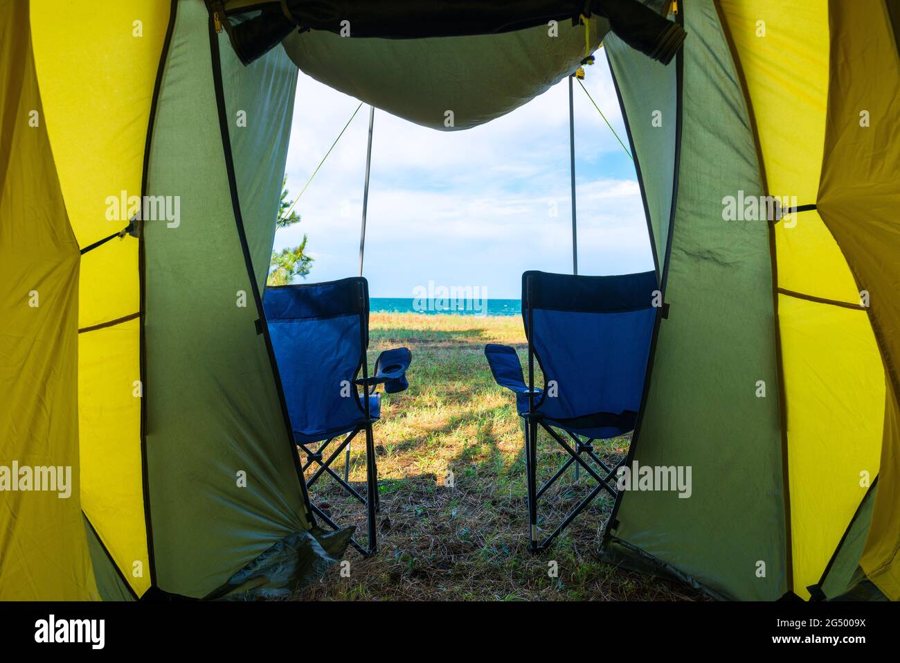Concept vacation, camping, relaxation - sea view from a camping tent Stock Photo