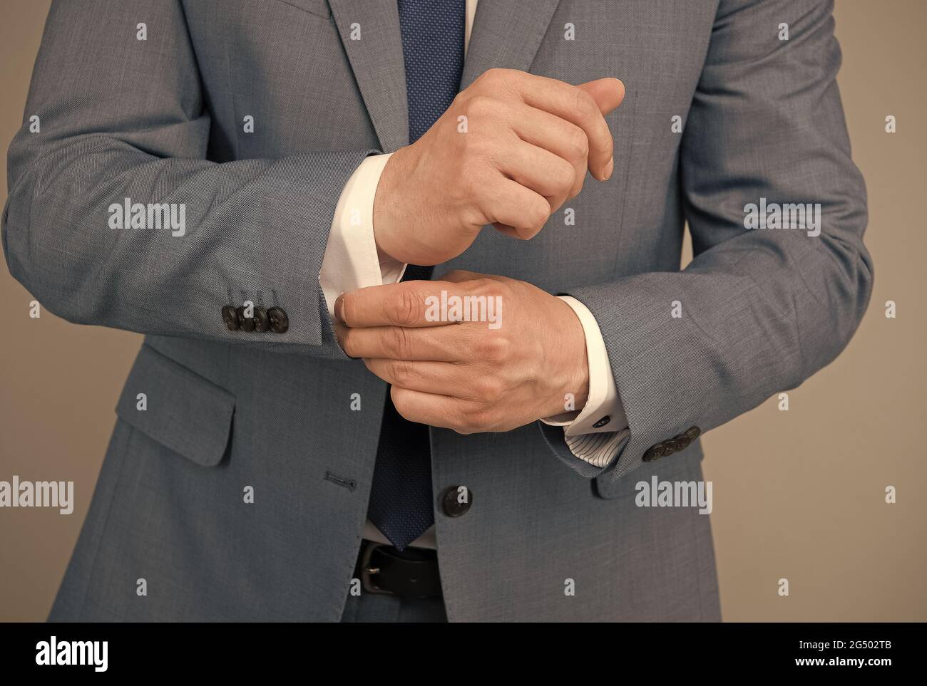 Hands adjusting sleeves formal suit business outfit, perfectionism concept Stock Photo