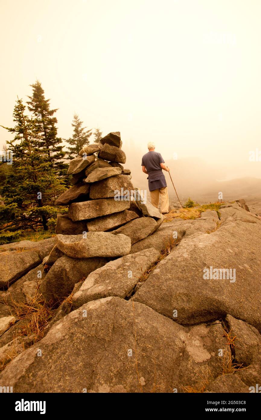 Man Hiking Along Coastal Trail at Fairy Head, Cutler Coast Public Land