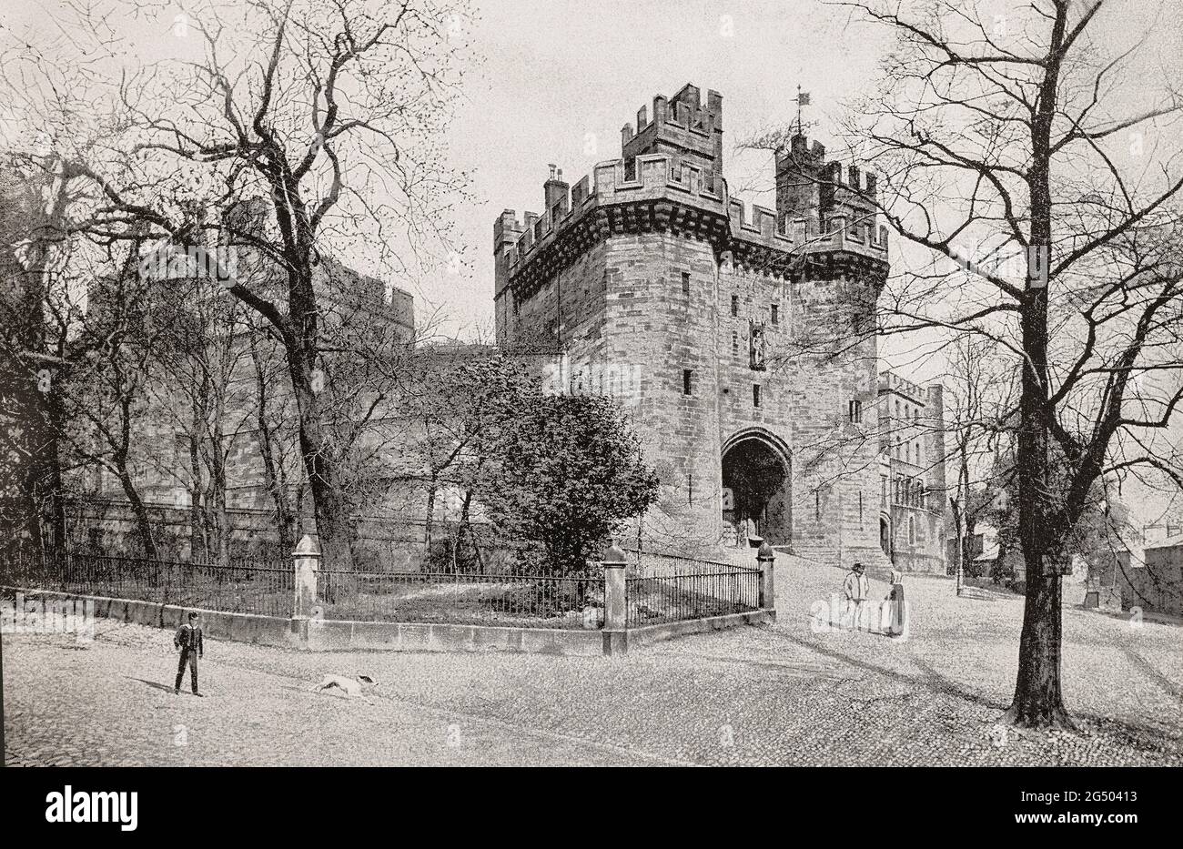 A late 19th century view of the main gatehouse to Lancaster Castle built at the start of the 15th century, instigated by King Henry IV, although legend attributes the work to John of Gaunt. A medieval castle in Lancaster in the English county of Lancashire it saw action in 1322 and 1389 when the Scots invaded England, progressing as far as Lancaster and damaging the castle. In the English Civil War, the castle was used as a prison. Stock Photo