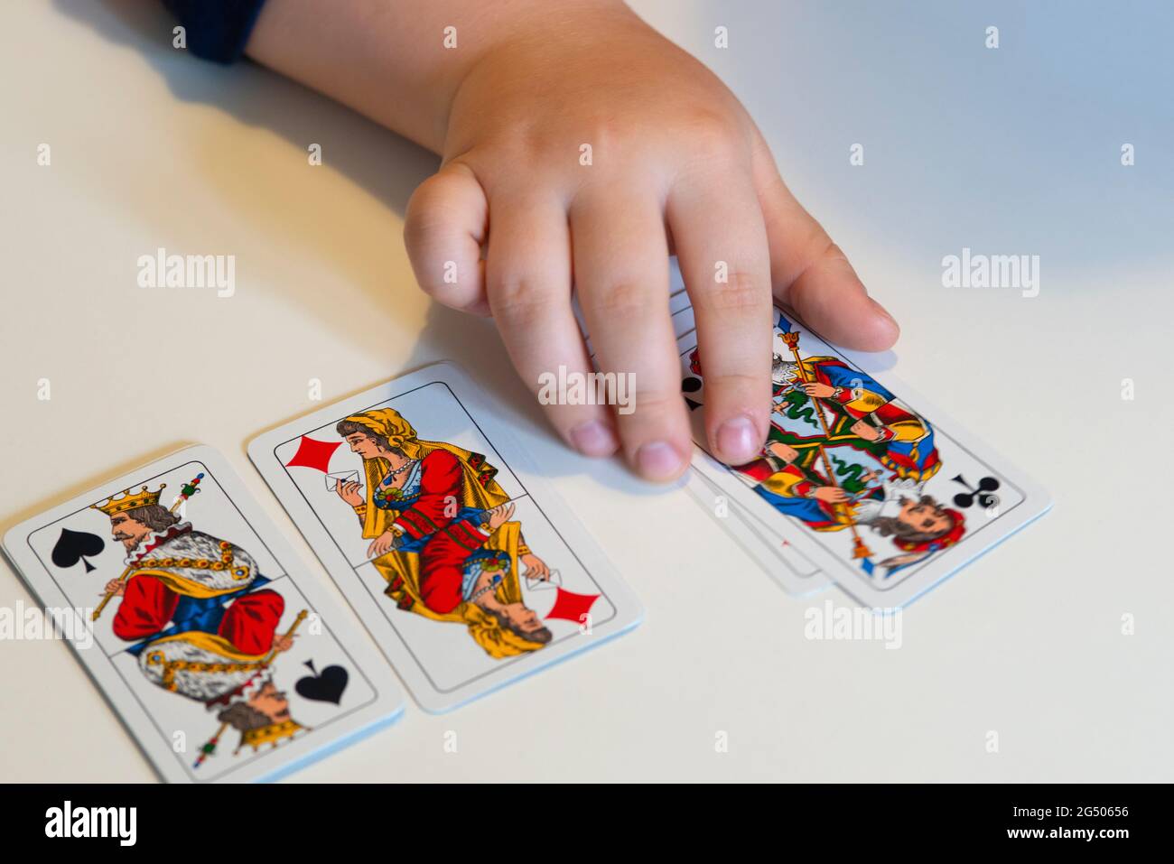 Boy Playing Cards Stock Photo
