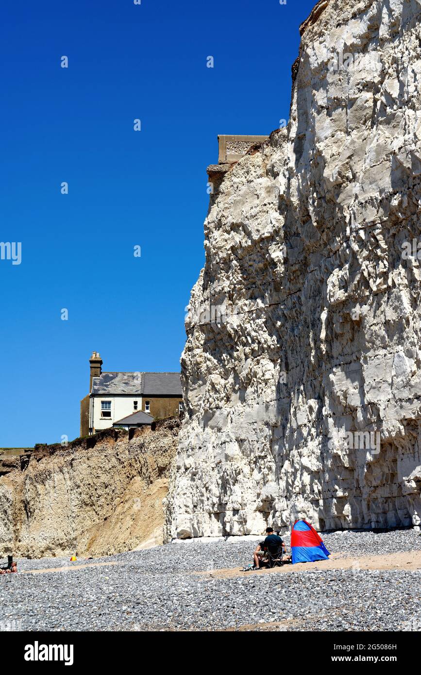 Old cottages perched on the cliff edge at Birling Gap due to severe ...