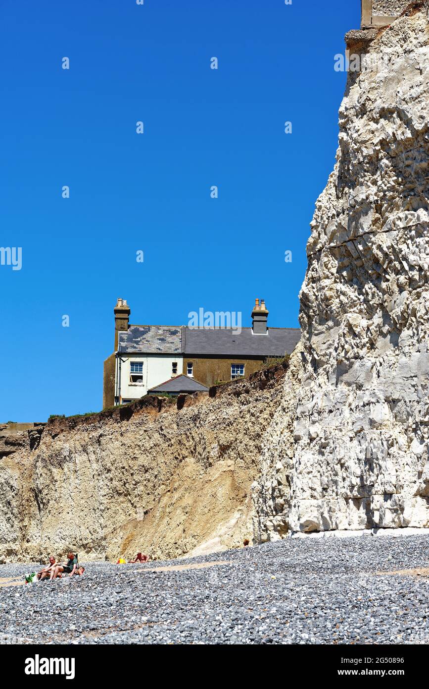 Old cottages perched on the cliff edge at Birling Gap due to severe ...