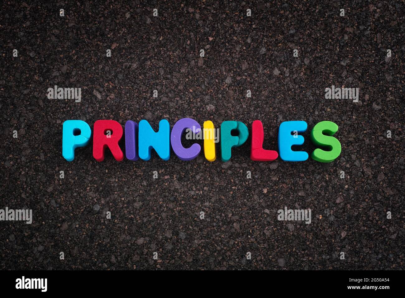 The word Principles on a dark cork board. Close up Stock Photo - Alamy