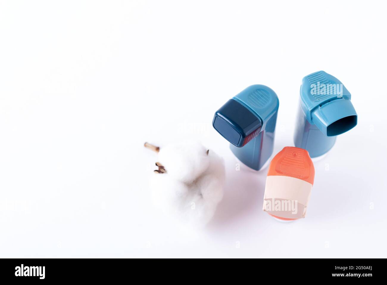 Three asthma inhalers on an isolated white background. Medical concept. Stock Photo