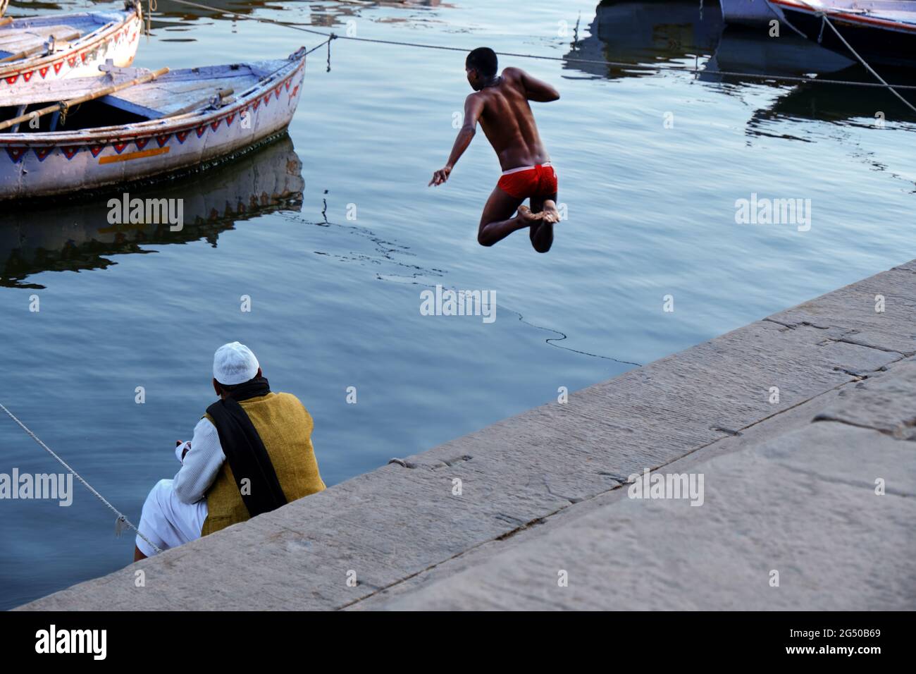 Indonisaian  boy river swim alamy 