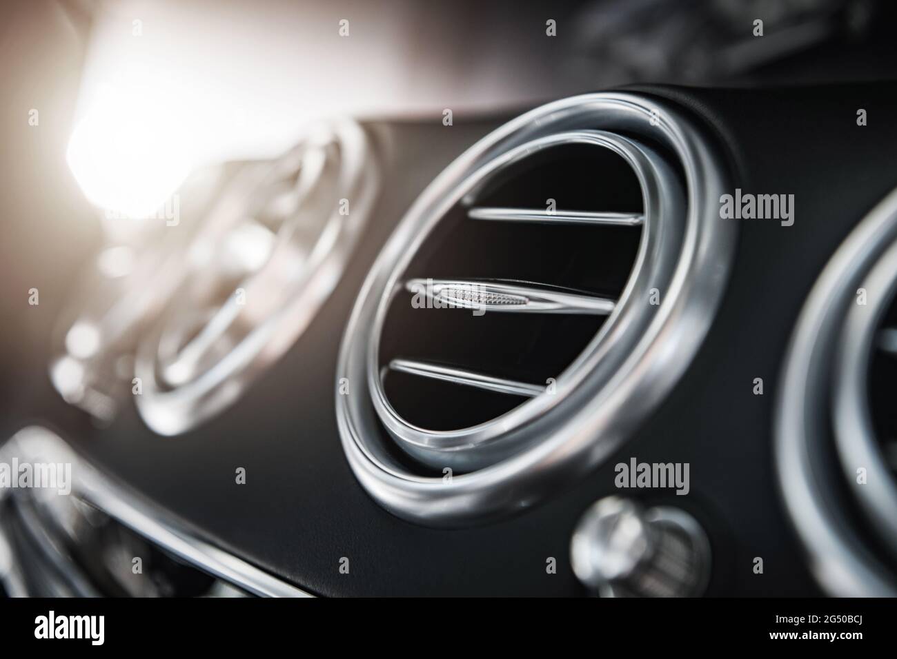 Modern Cars Interior Air Vents. Air Cleaning and Conditioning Inside Luxury Vehicle. Stock Photo