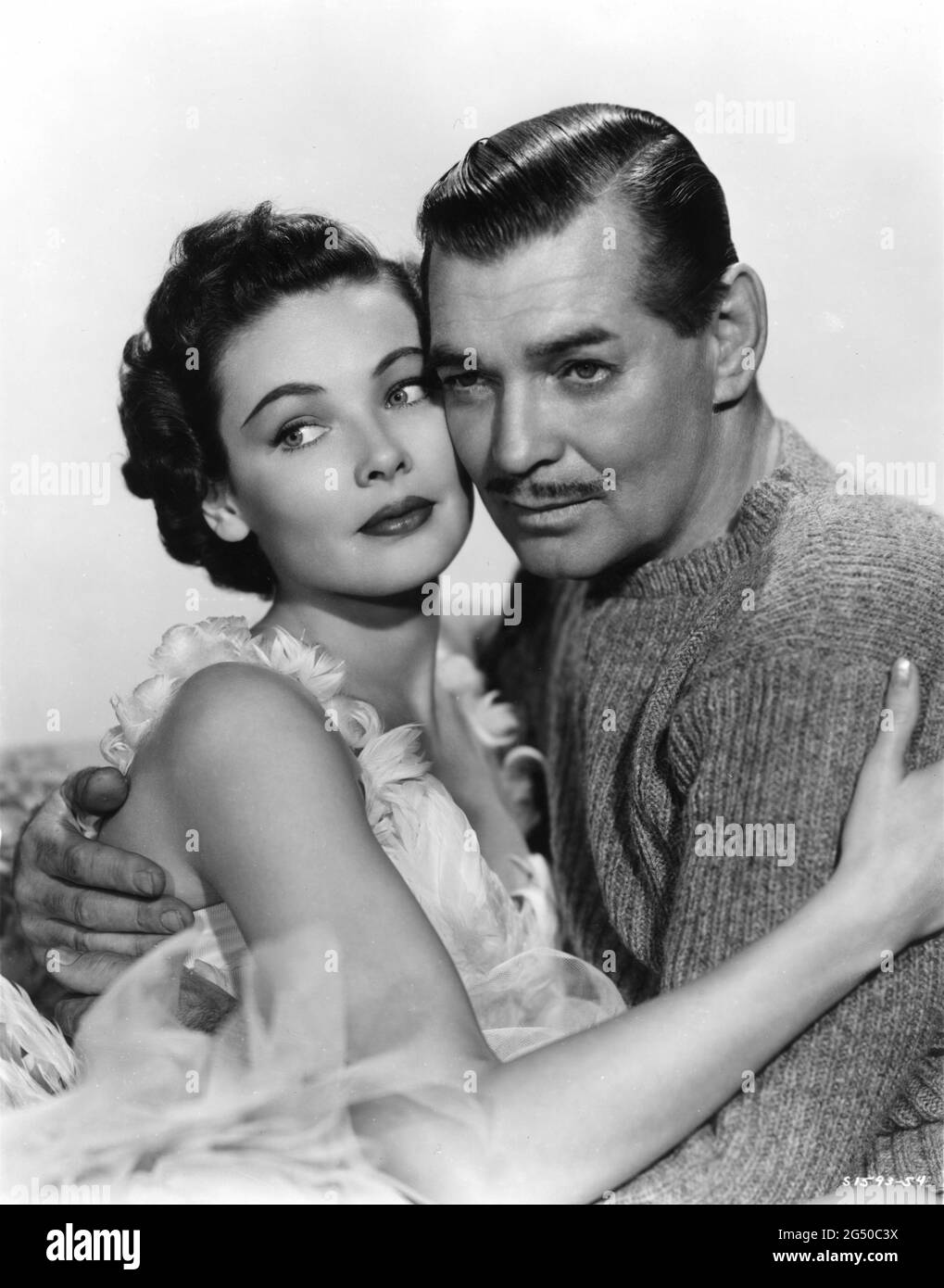 GENE TIERNEY and CLARK GABLE Publicity Portrait in NEVER LET ME GO 1953 director DELMER DAVES from novel Come The Dawn by Paul Winterton producer Clarence Brown Metro Goldwyn Mayer Stock Photo
