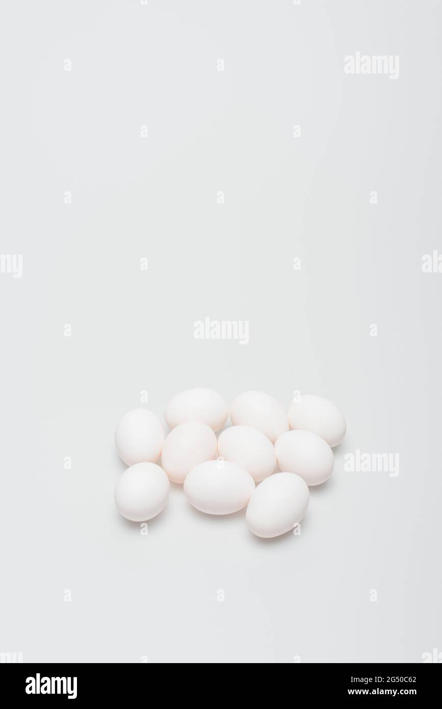 raw and organic eggs on white background Stock Photo - Alamy