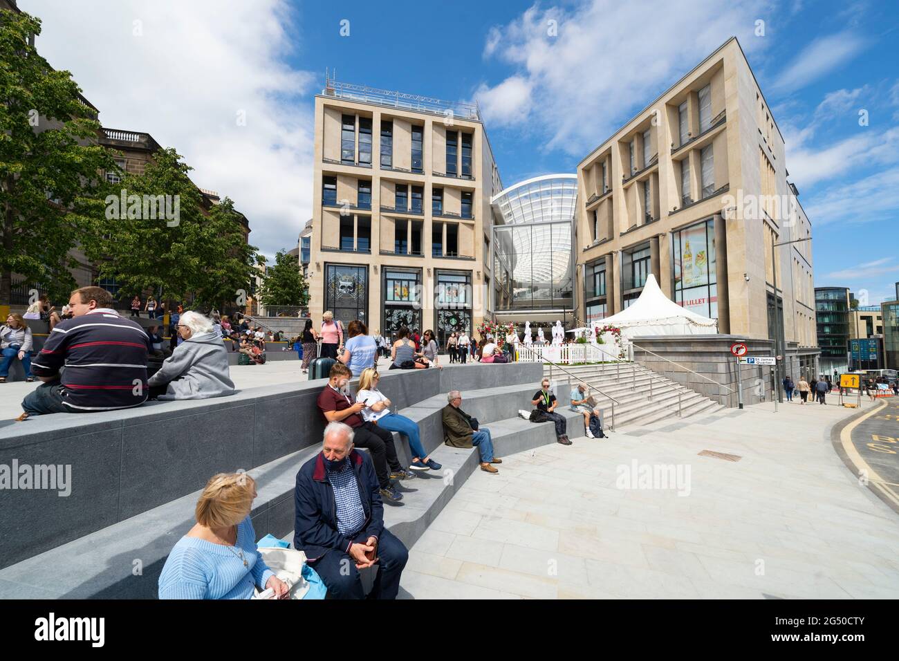 Edinburgh, Scotland, UK. 24 June 2021. First images of the new St James Quarter which opened this morning in Edinburgh. The large retail and residential complex replaced the St James Centre which occupied the site for many years. Pic; Members of the  public at entrance to mall on Leith Street .Iain Masterton/Alamy Live News Stock Photo