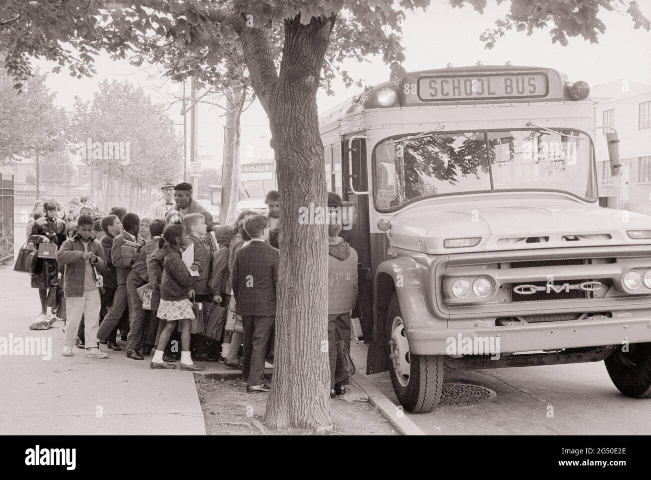 Vintage photo of New York schools. Children get on the school bus. USA. October 1, 1964 Stock Photo