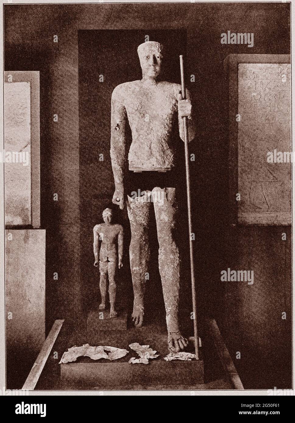 Ancient Egypt. Old Kingdom. Life-size statue of Pepi I, with figure of his son, both of beaten copper. 1912 book illustration Stock Photo