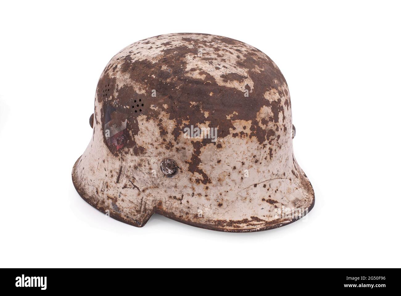 Germany at the World War II. German army helmet (model M35) with winter camouflage and decals on isolated background. Stock Photo
