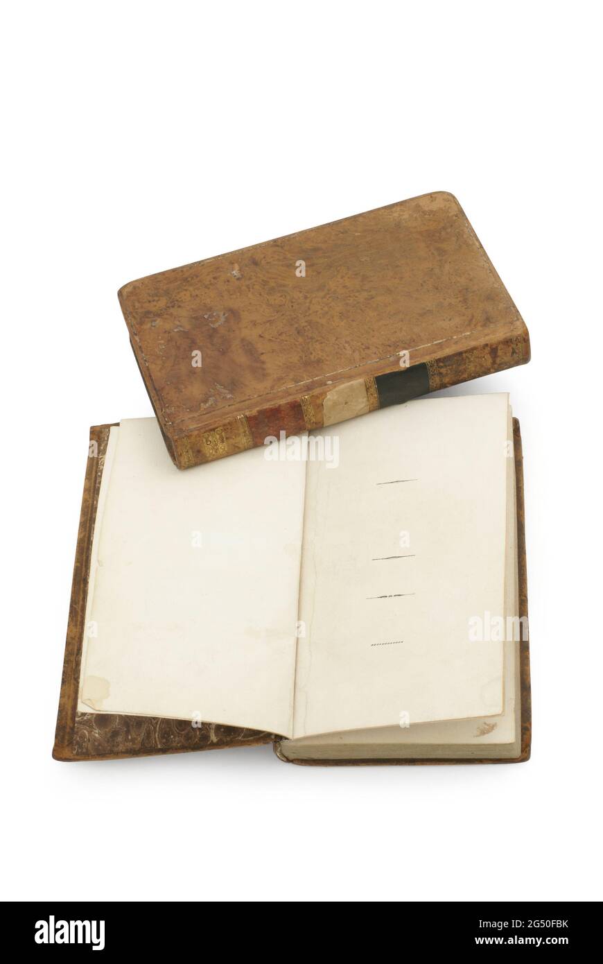 Antique book of 19th century opens on both blank shabby pages with stains and scratches. Stock Photo