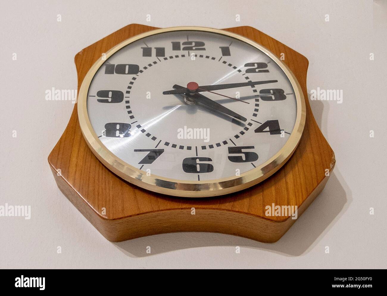 Vintage analog clock hanging on the wall Stock Photo Alamy