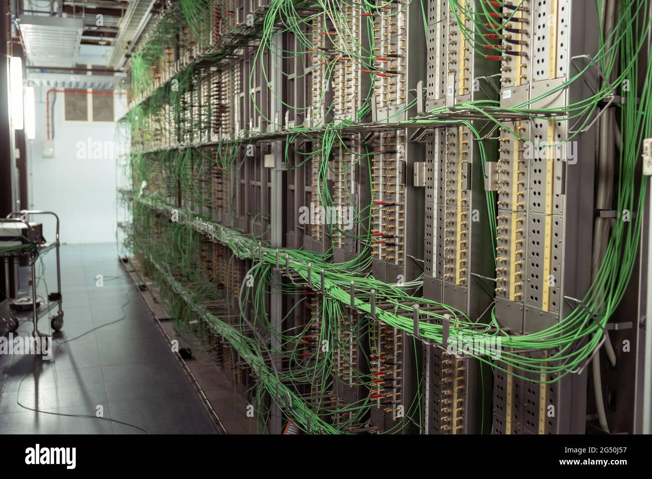 Server room with green wires Stock Photo - Alamy