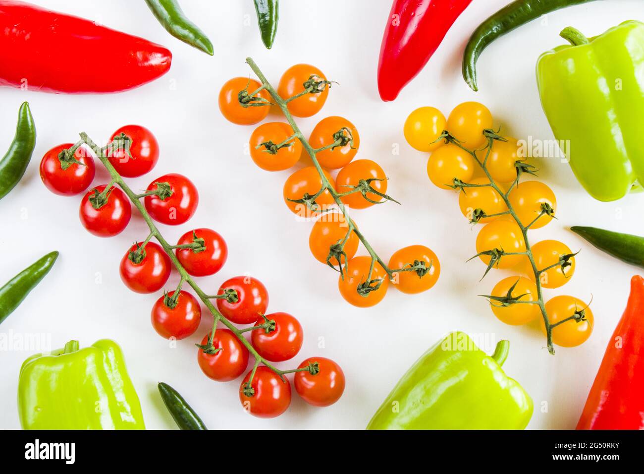 Top view of ripe colorful peppers and cherry tomatoes isolated on white ...